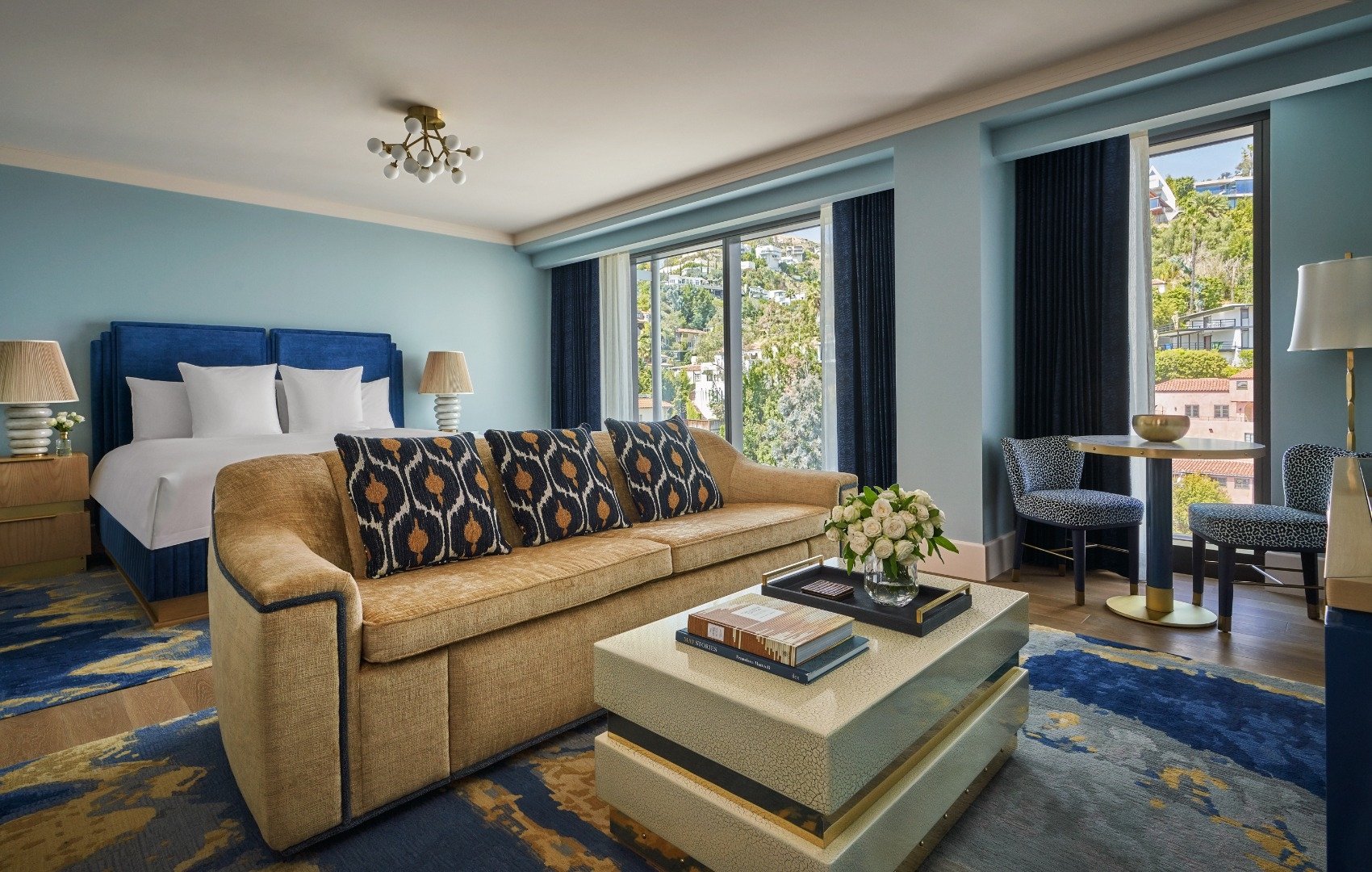 A bed room at The Sun Rose with views of West Hollywood in the background