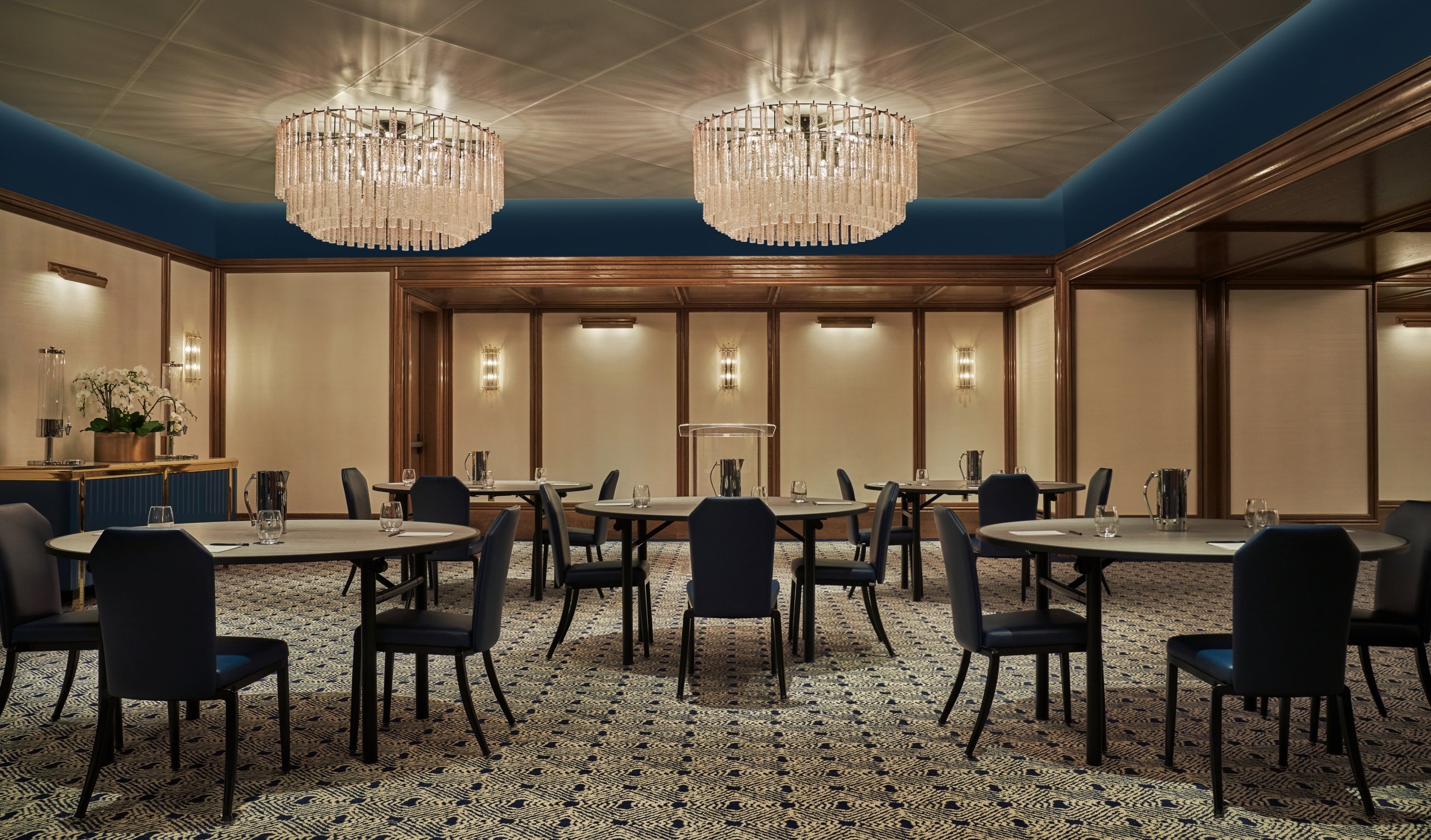 Tables and chairs set up in a meeting space at The Sun Rose