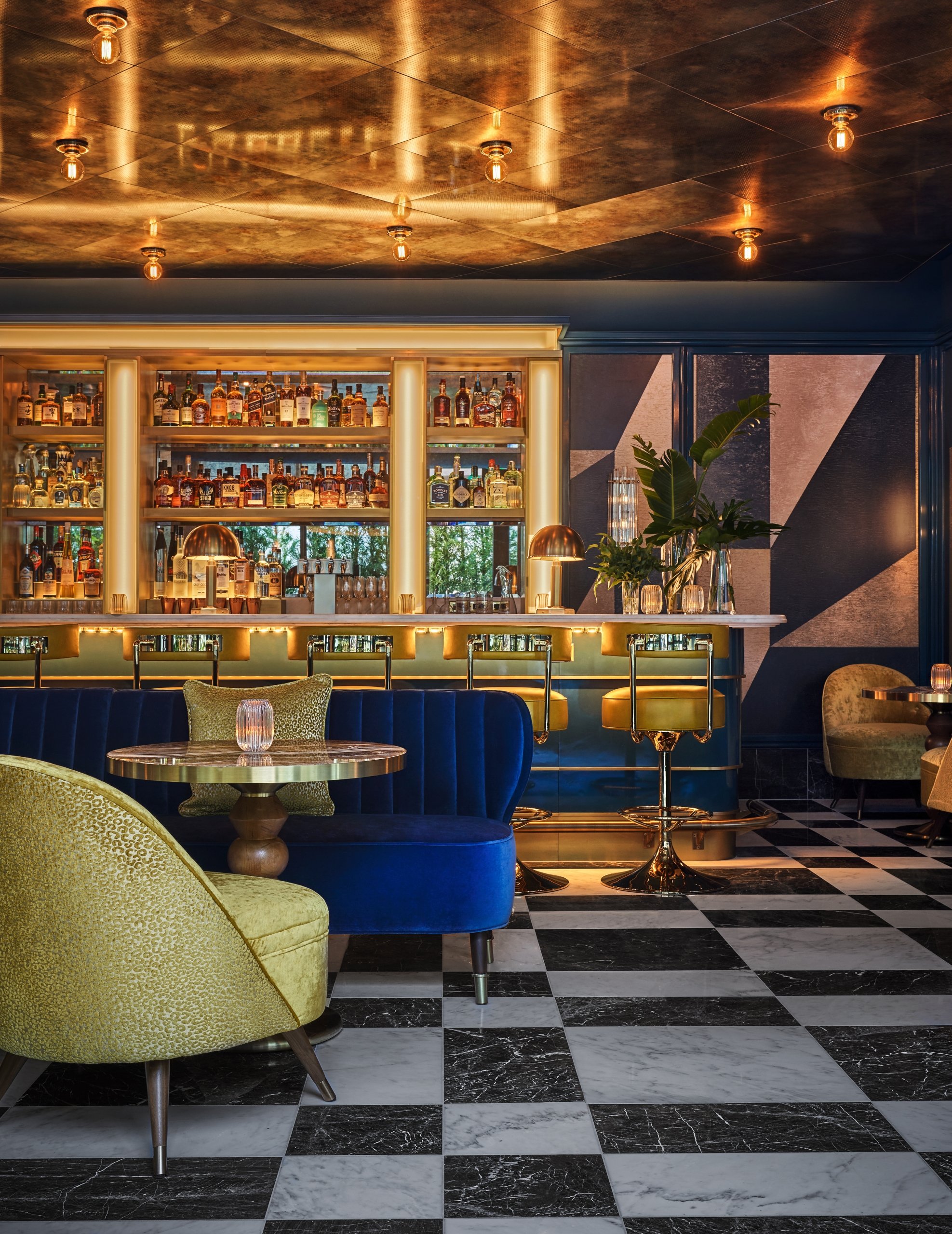 The Bar area at The Sun Rose with tables and chairs throughout the room