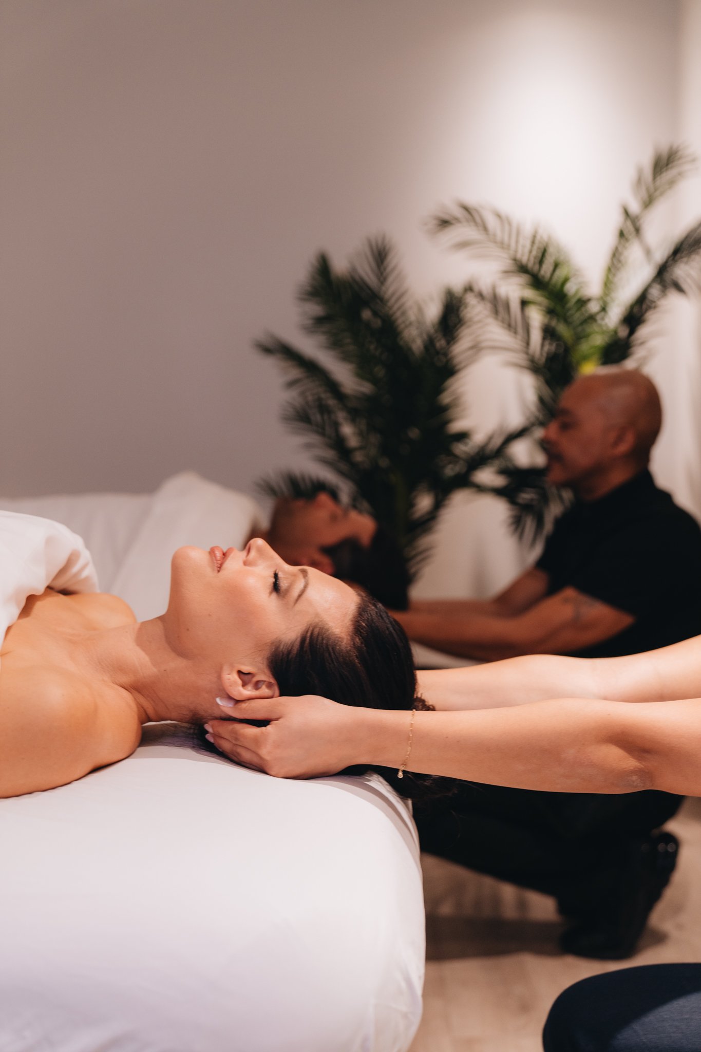 A couple getting massages at The Sun Rose