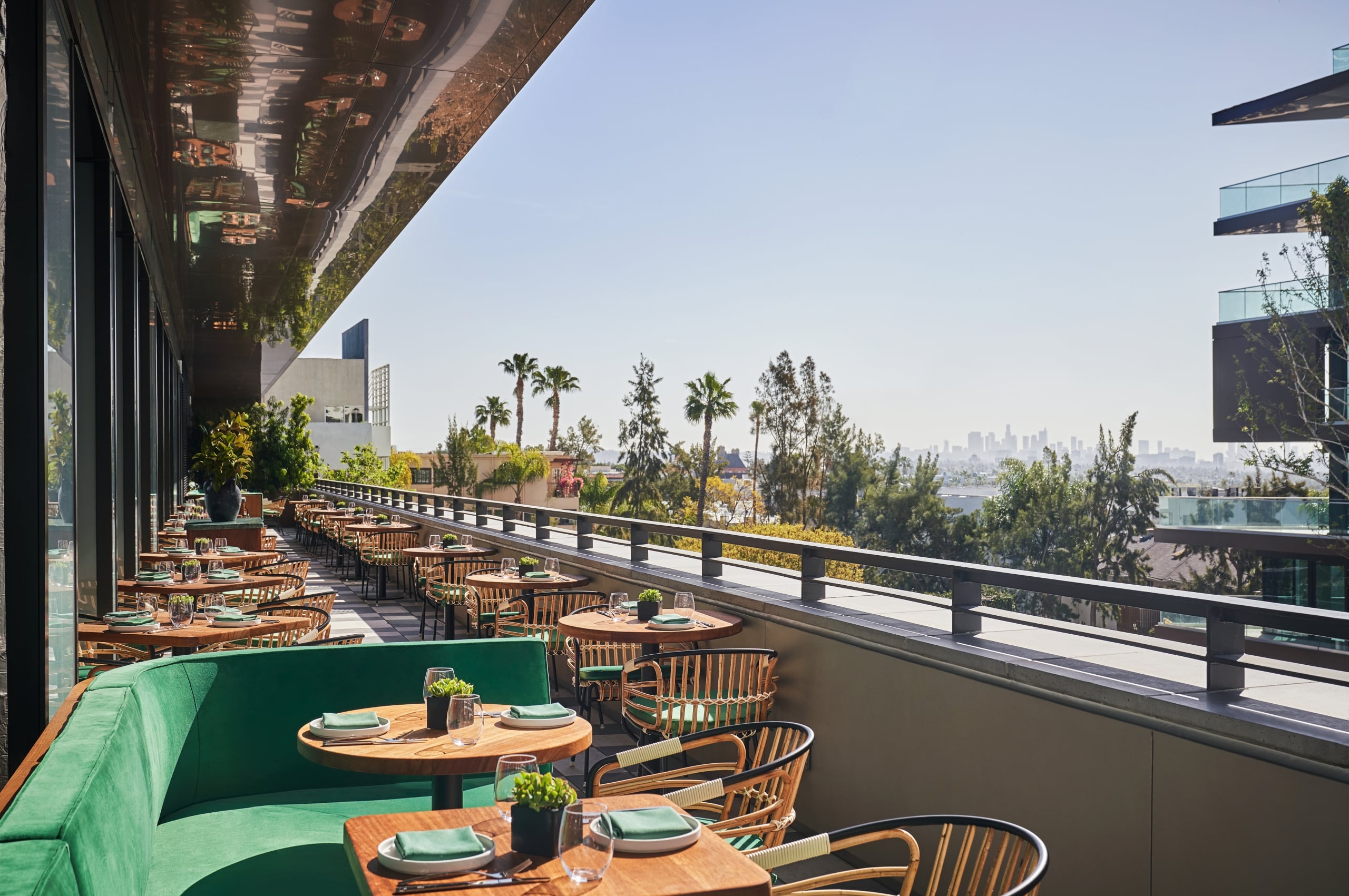 Patio views from The Sun Rose Cafe at the Sun Rose West Hollywood with ample outdoor seating and views of the los angeles skyline