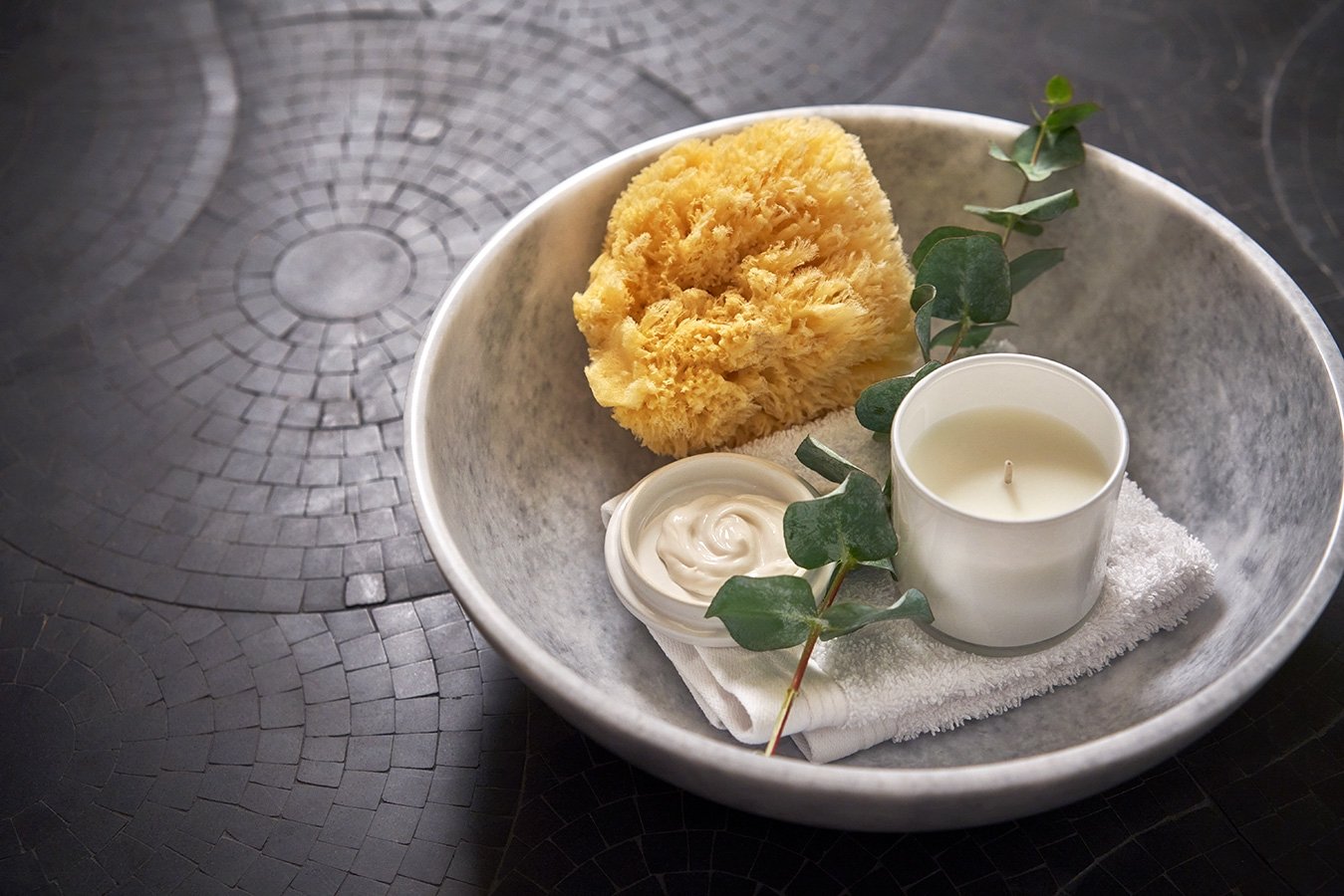 Close up of a candle in a bowl at The Sun Rose