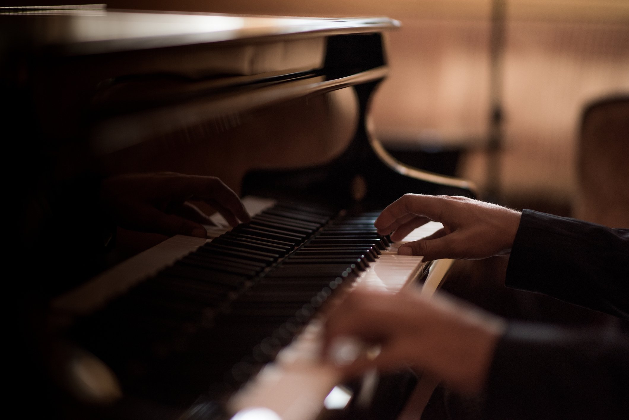 Close up of someone playing the piano at The Sun Rose