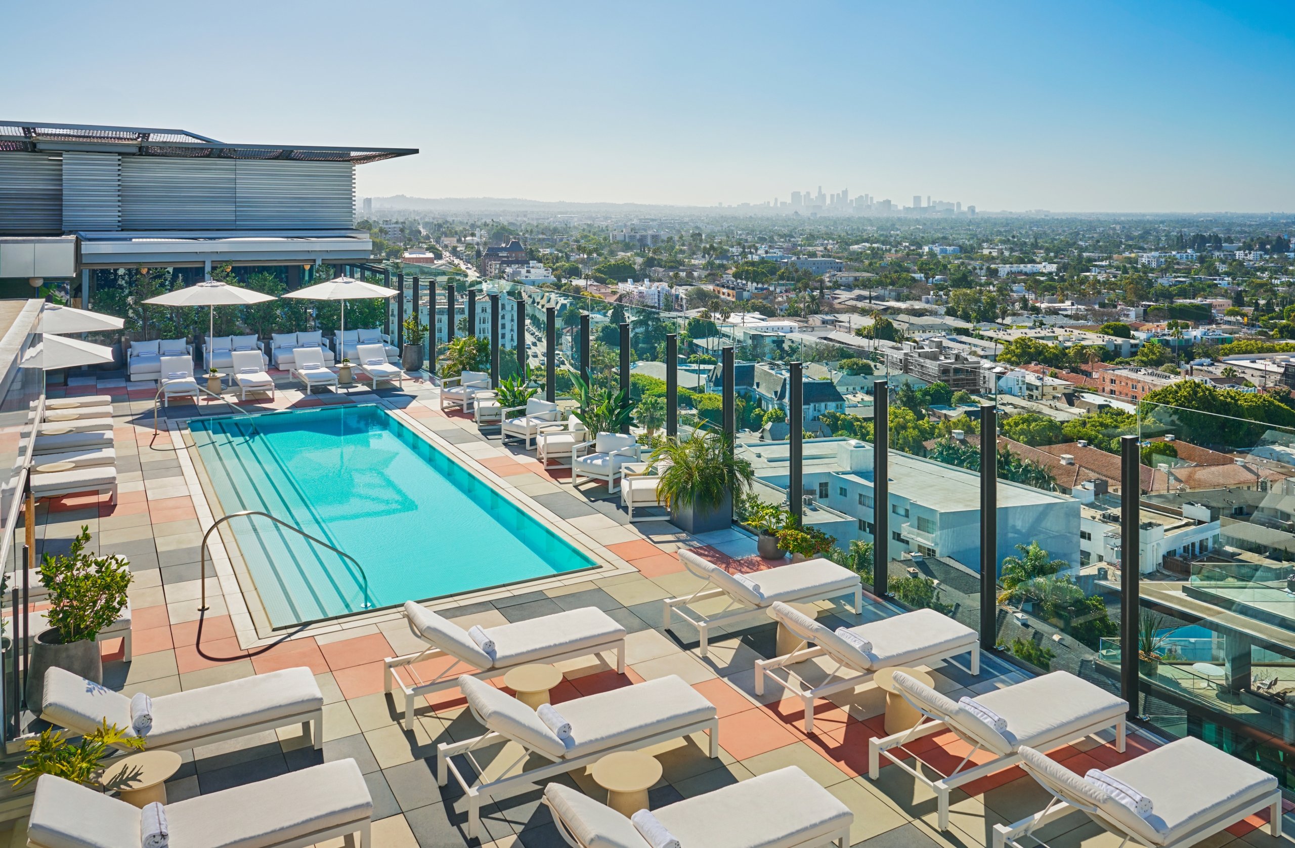 Rooftop image of The Sun Rose West Hollywood, featuring pool and Los Angeles Skyline.