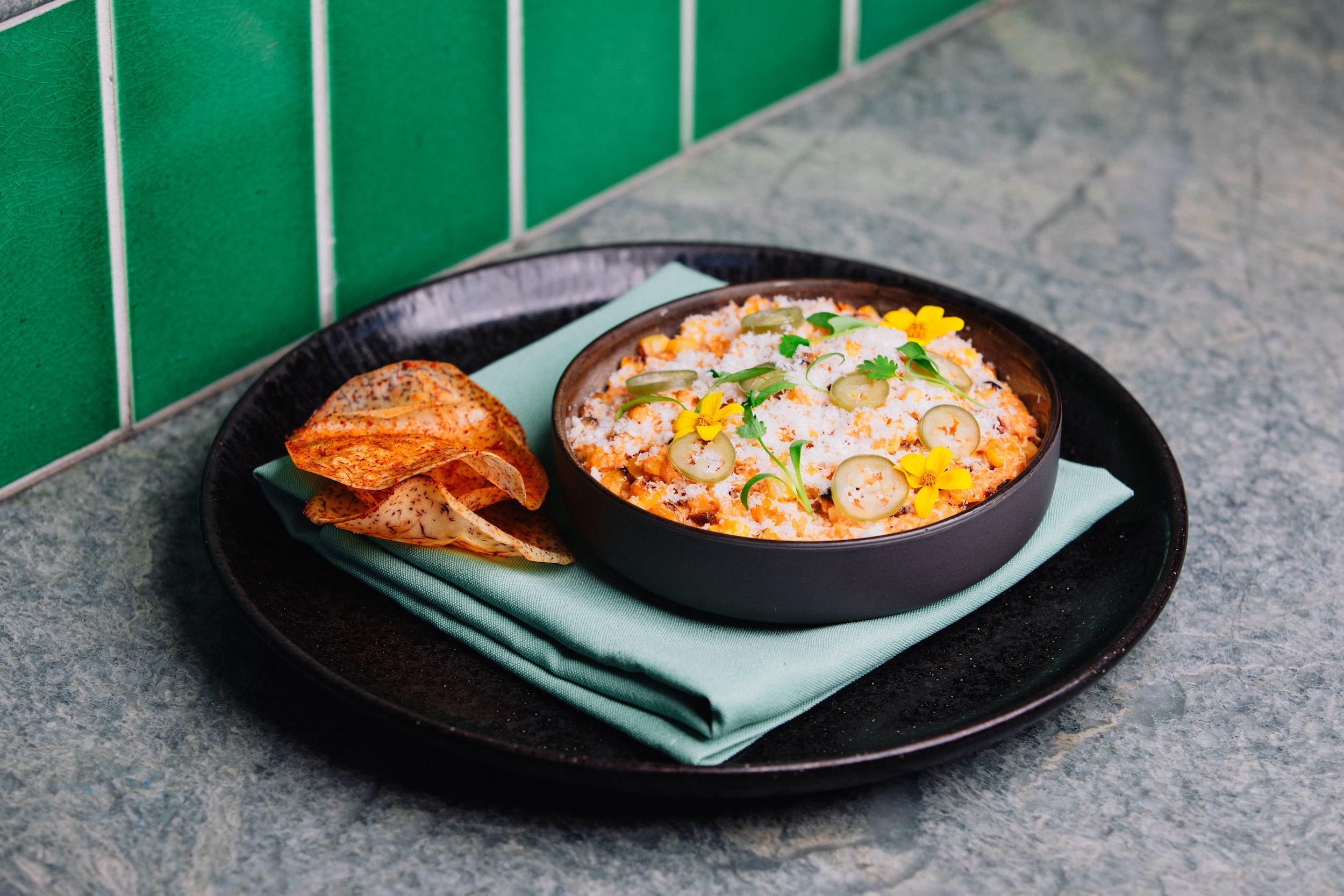 A picture of plated Crab Esquites.