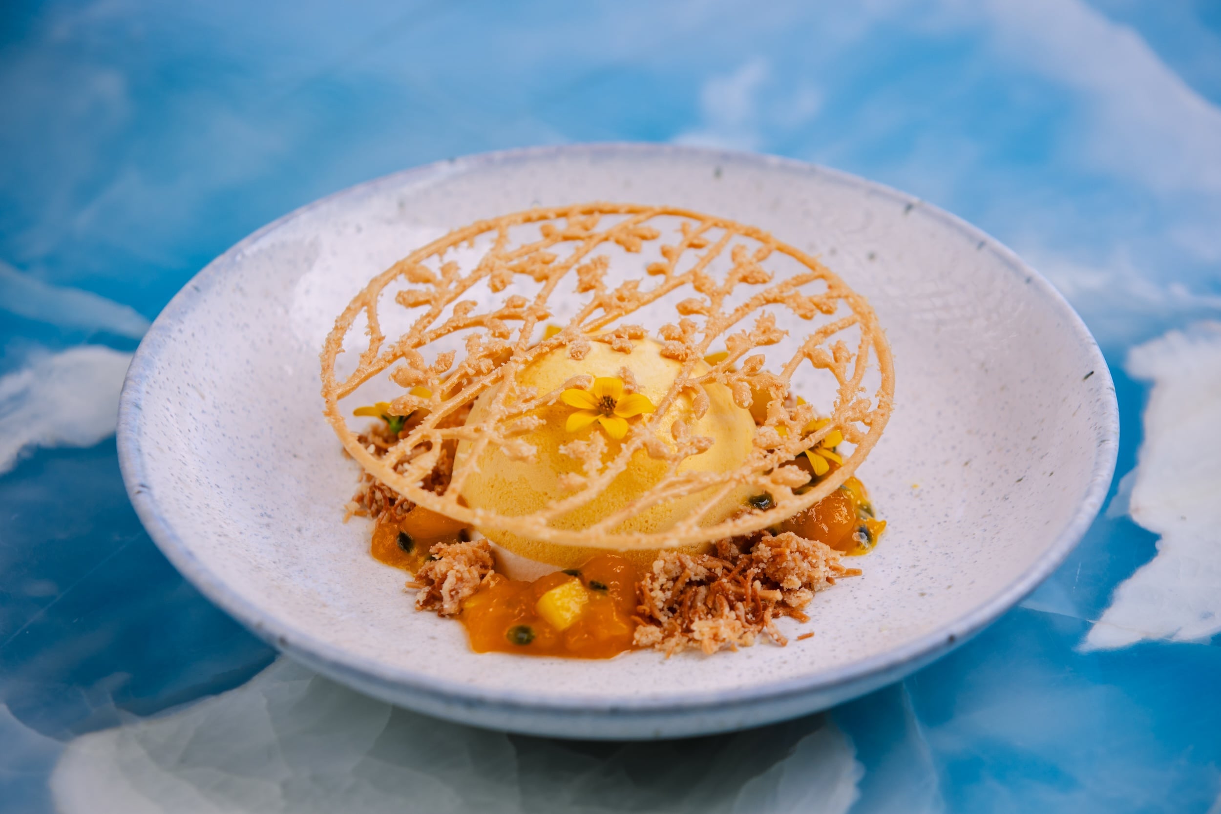 A picture of plated mango yogurt semifreddo.