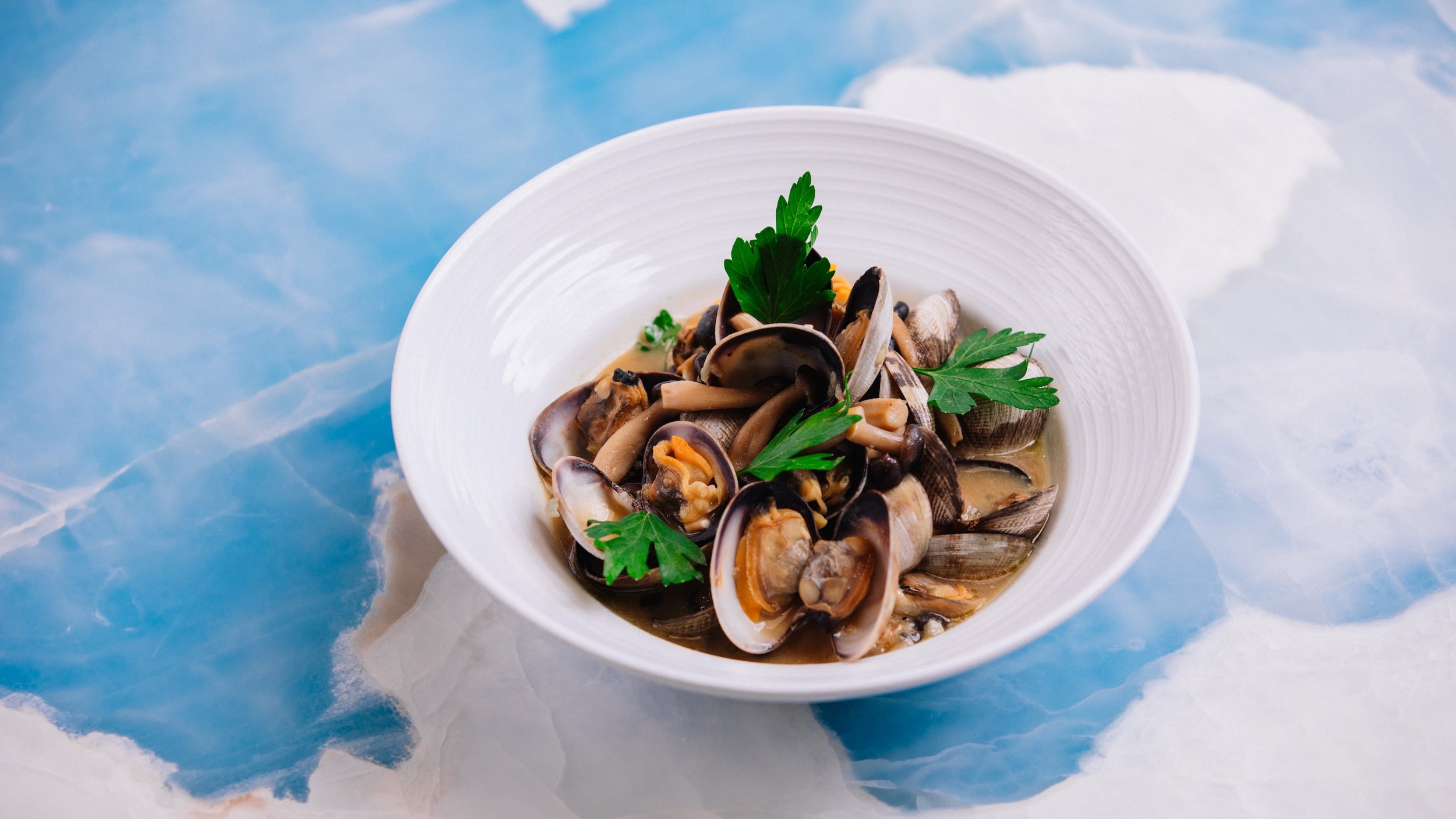 A picture of plated Miso Clams.